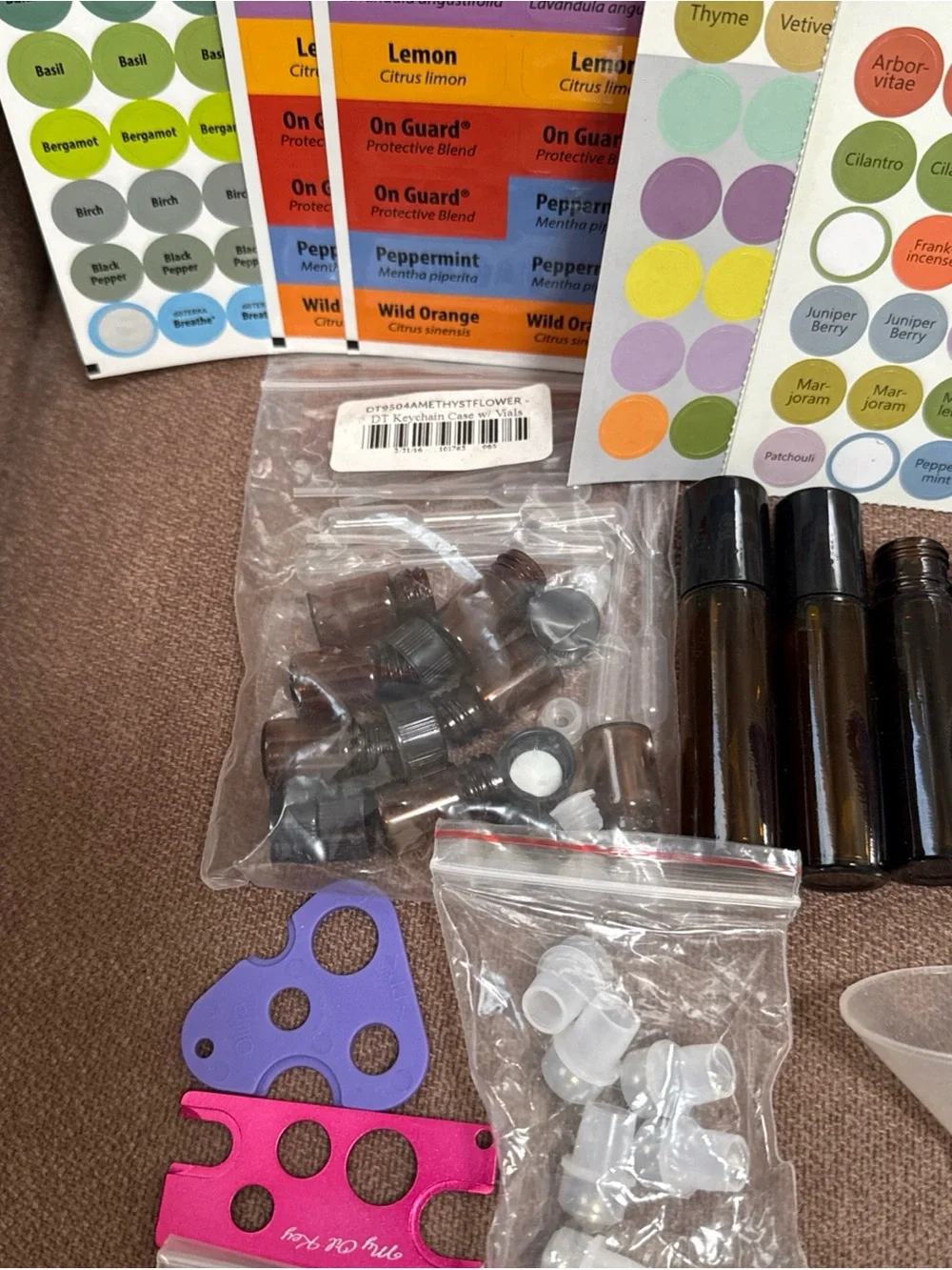DōTerra essential oil box with 13 new/opened exp oils with extra bottles/info.